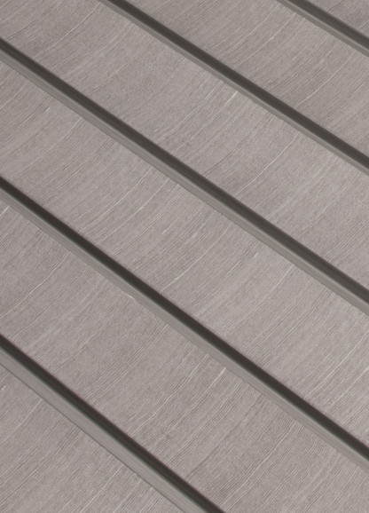 Panou decorativ riflat 3D gri si amber intr-un interior modern