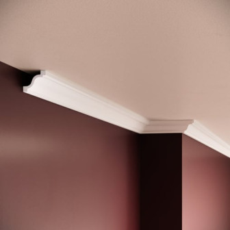 Cornișă decorativă din polimer rigid montată între tavan și perete